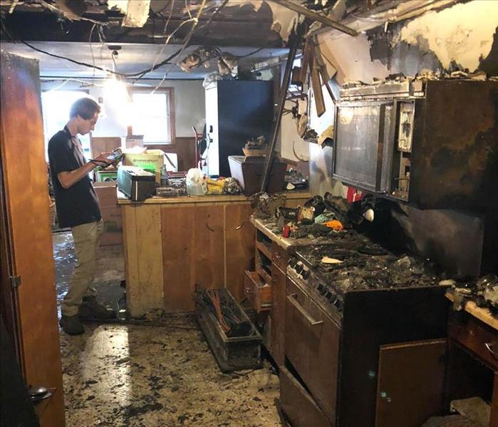 Kitchen with extensive fire damage.