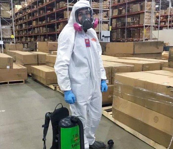 full PPE on a SERVPRO employee before mold remediation