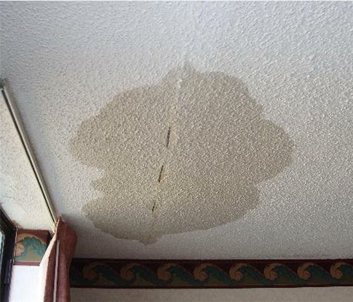 Wet stain on a ceiling.