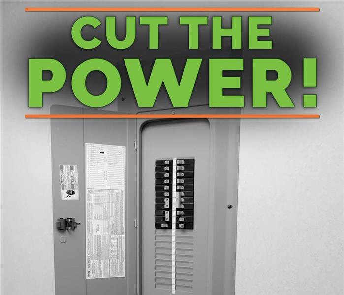 A breaker panel with a sign on top that says "Cut the power"